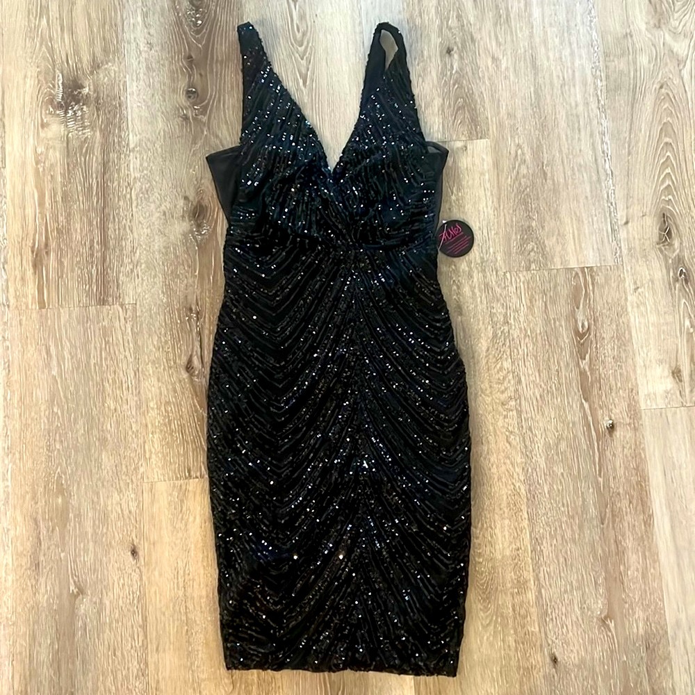 Gorgeous black sequined dress with mesh detail on sides